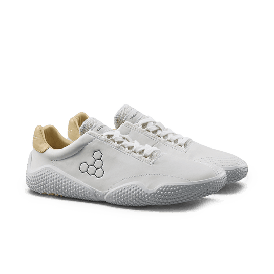 Vivobarefoot Motus Studio Leather Sneaker – Bright White featuring a sleek design and natural leather upper.