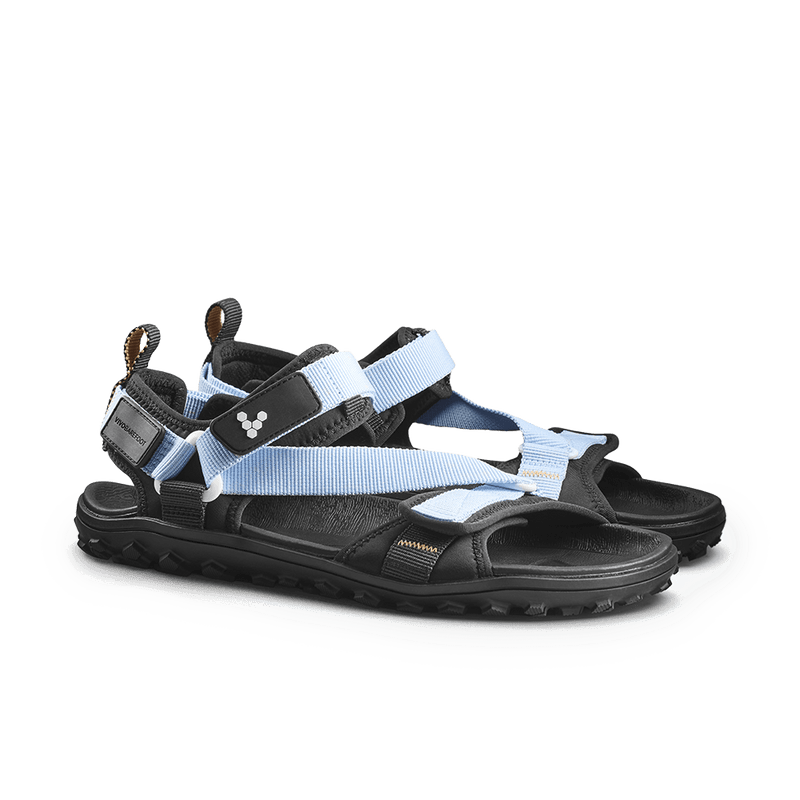 Load image into Gallery viewer, Vivobarefoot Tracker Ora Sandal Womens Skyway in black and sky blue with rugged sole for outdoor activities.