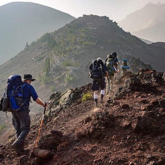 Group of hikers bushwalking on a rugged trail in the Australian outback