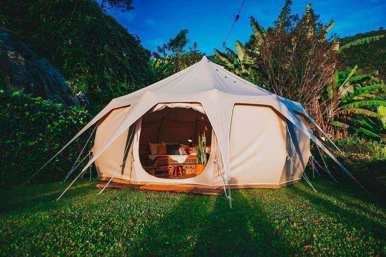 Spacious new tent setup in lush green environment for an upcoming adventure.