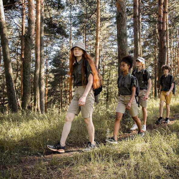 Group of hikers walking on a forest trail promoting sustainable trail etiquette in Australia