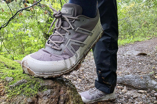 A close-up of barefoot hiking shoes Australia on a rock, perfect for outdoor adventures in nature. - Adventureco Blog