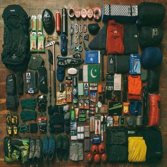 Collection of eco-friendly hiking gear for conscious explorers including backpacks, apparel, water bottles, and survival equipment - Adventureco Blog