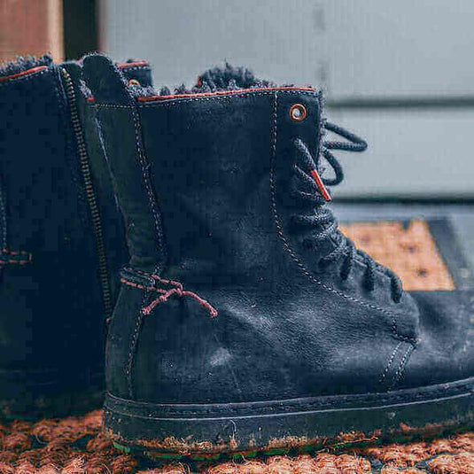 Black hiking boots with sturdy soles and leather finish for trail hiking. - Adventureco Blog