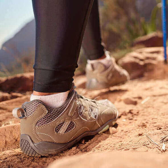 Sustainable hiking shoes on a rocky trail in nature - Adventureco Blog