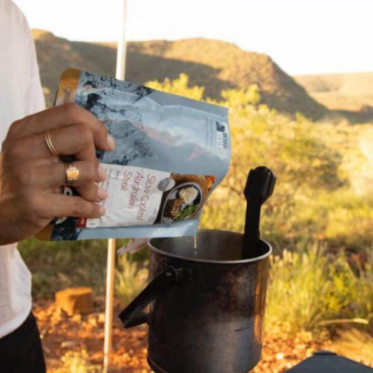 Preparing On-Track meal from AdventureCo during an outdoor adventure