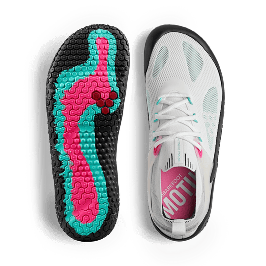 Vivobarefoot Motus Strength Womens Blue Tint performance sneakers featuring a colorful sole design for high-intensity workouts.