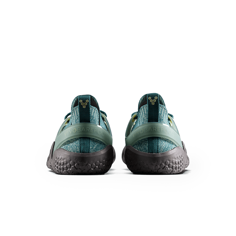 Load image into Gallery viewer, Vivobarefoot Motus Strength Womens Glacial Green sneakers from the back showcasing grip and stability features.
