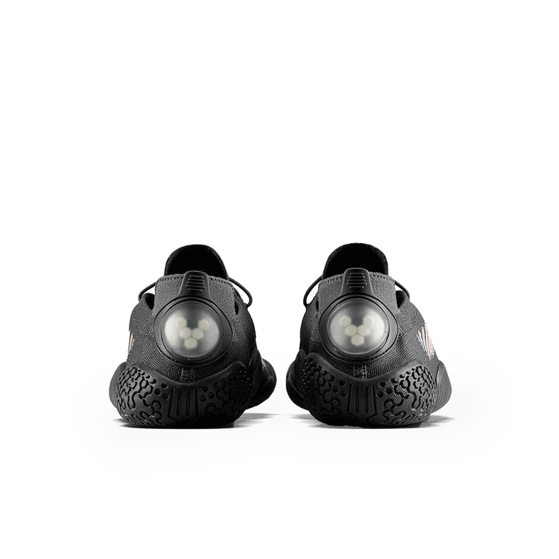 Load image into Gallery viewer, Vivobarefoot Motus Flex Womens Obsidian/Space Dye shoes showcasing the back view with unique outsole design.
