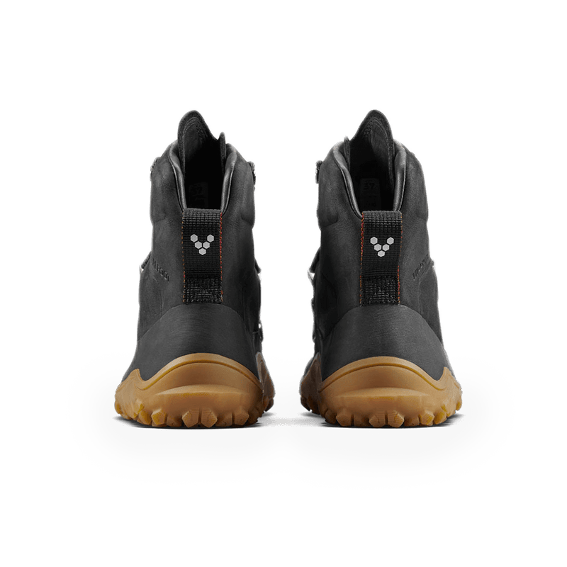 Load image into Gallery viewer, Vivobarefoot Tracker Leather AT women&#39;s boots in obsidian color, showcasing rear view with high-performance outsole.
