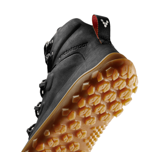 Vivobarefoot Tracker Leather AT women's boot showing advanced grip outsole and lightweight design for all-terrain performance.