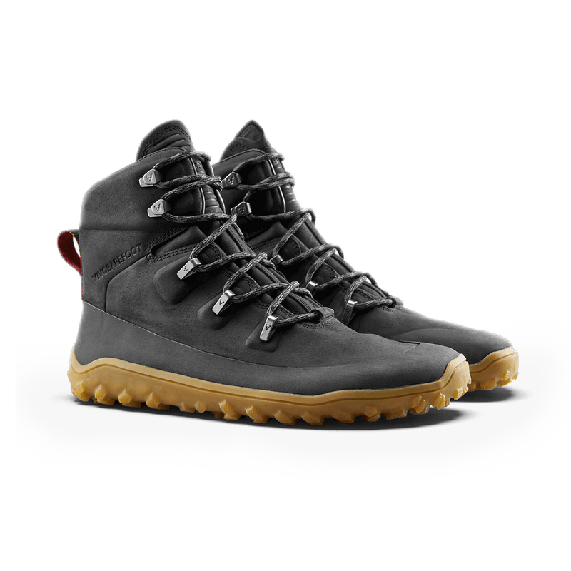 Load image into Gallery viewer, Vivobarefoot Tracker Leather AT women&#39;s hiking boots in obsidian color with a rugged outsole design.
