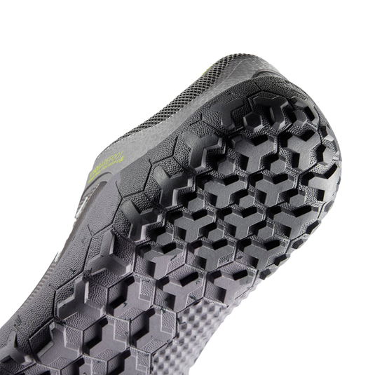 Bottom view of Vivobarefoot Primus Trail II FG women's shoe, featuring a durable hexagonal tread for traction on trails.