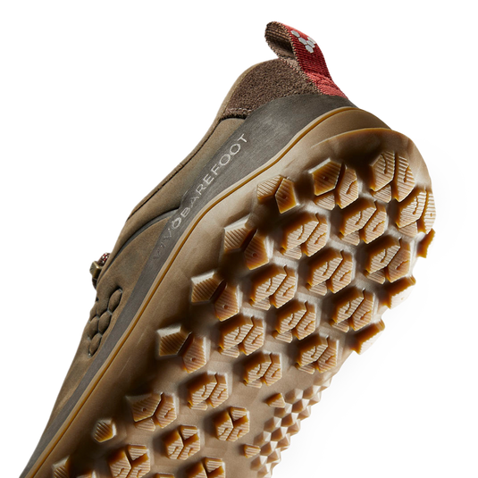 Vivobarefoot Tracker Leather Low women's boot sole showing rugged grip and breathability features for all-terrain performance.