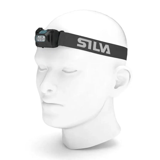 Silva 3XTH Headlamp on mannequin head, showcasing lightweight design for outdoor adventures. Features night vision-mode and battery indicator.