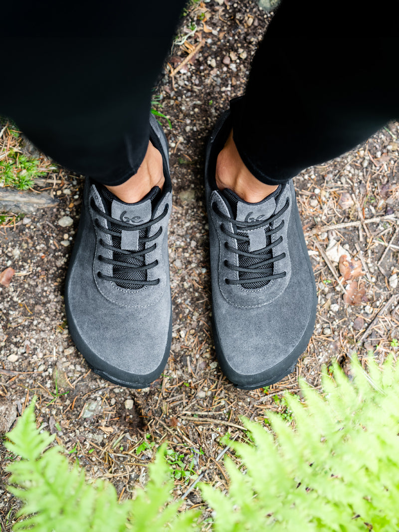 Load image into Gallery viewer, Top view of Be Lenka Trailwalker 3.0 dark grey barefoot shoes on a natural trail with greenery.
