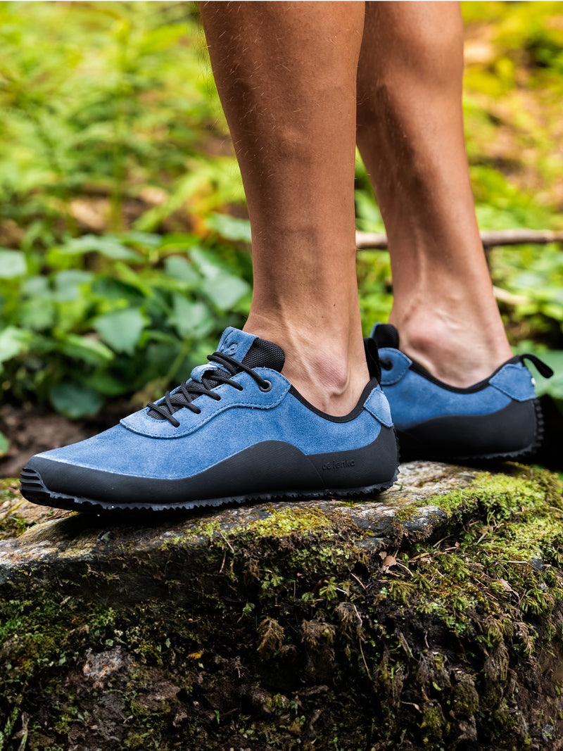 Load image into Gallery viewer, Be Lenka Trailwalker 3.0 navy shoes on a rocky surface in nature, showcasing flexibility and outdoor style.
