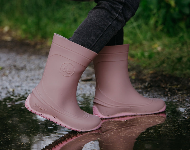 Load image into Gallery viewer, Be Lenka Kids Barefoot Rain Boots in Misty Pink worn by a child, perfect for rainy adventures.
